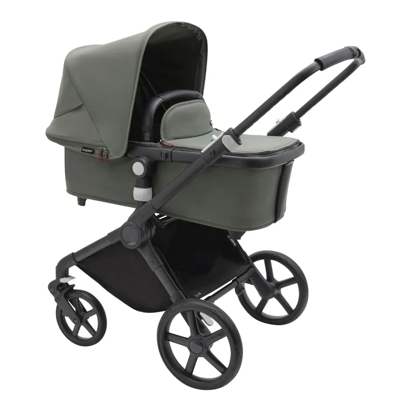 Cub Kombikinderwagen schwarz | gruen by Bugaboo in Black, Green, 87 × 55 × 34 mm – product photo