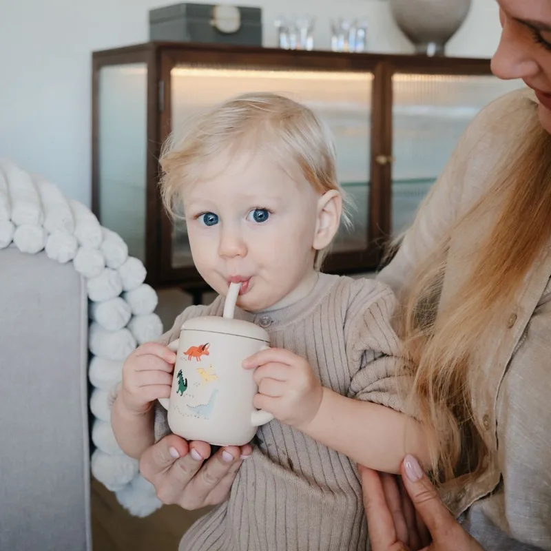 Oefenbeker met Rietje - Dino by Mushie in Beige 2 – product photo 1 of 4
